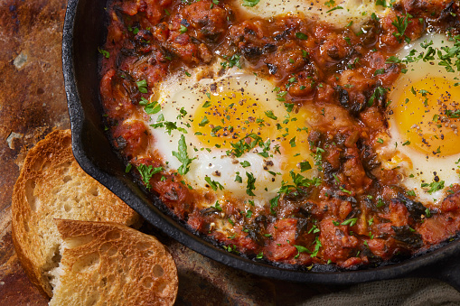 Italian Style Eggs in Purgatory with Italian Sausage, Tomato Sauce and Toasted Bread