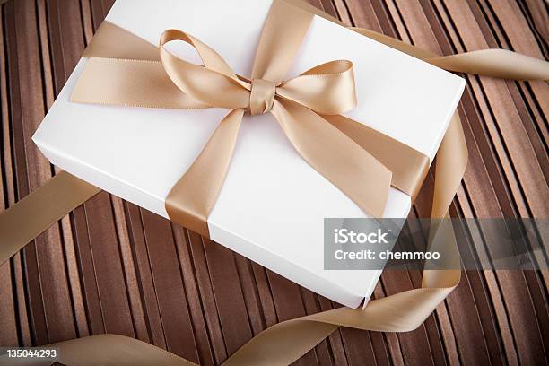Holiday Scene White Gift Box With Golden Ribbon Stock Photo - Download Image Now - Abstract, Anniversary, Bag
