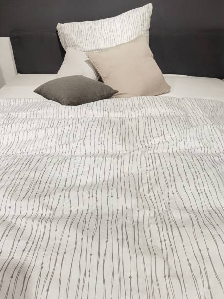 istock a bed that is not tidy with a blanket and pillow 1350444257