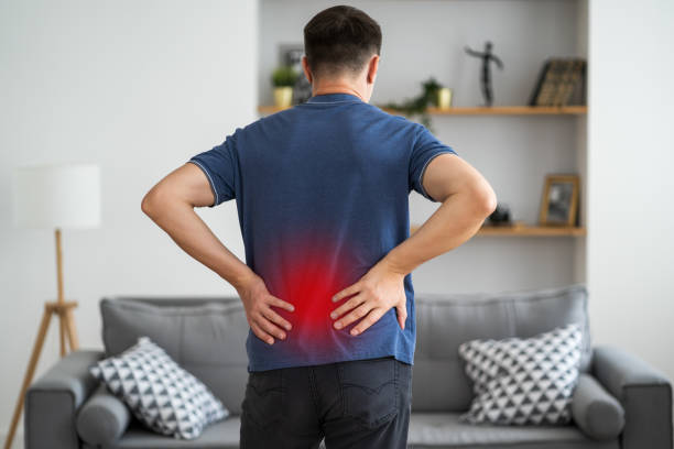 istock Back pain, kidney inflammation, man suffering from backache at home 1350444789