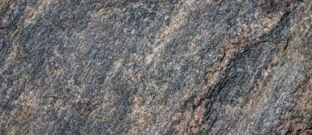 istock texture of granite nature stone - grunge stone surface background 1350444793