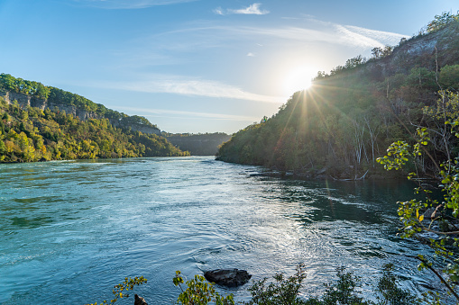 The scenic river goes through the Vachkazhets valley at Kamchatka krai, Russia, with beautiful mountains and grass fields around.