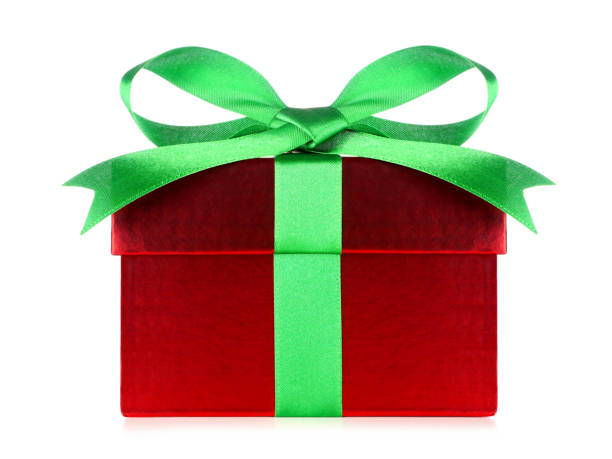 istock Red gift box wrapped with  green bow and ribbon isolated on white 1350450978