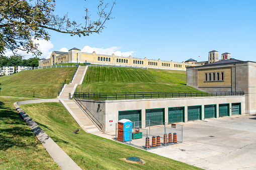 Large wide concrete staircase in a new residential area and a green flower bed