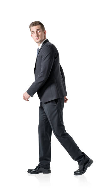 istock Handsome business man go walk making step, businessman wear eleg 1350453119