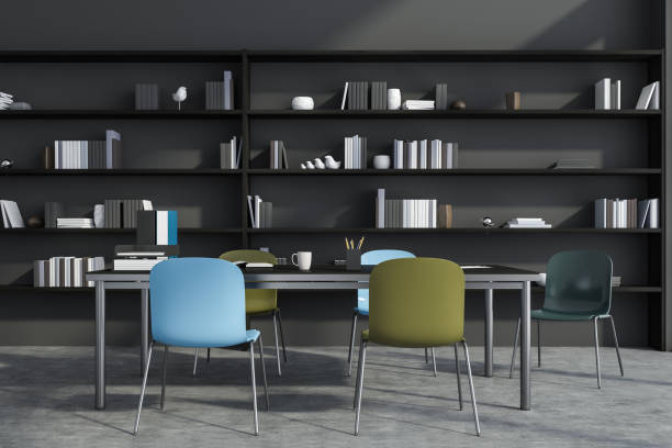 istock Stylish grey office with blue and green chairs 1350454326