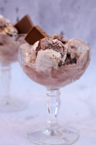 istock Ice cream with chocolate in crystal glasses 1350456394