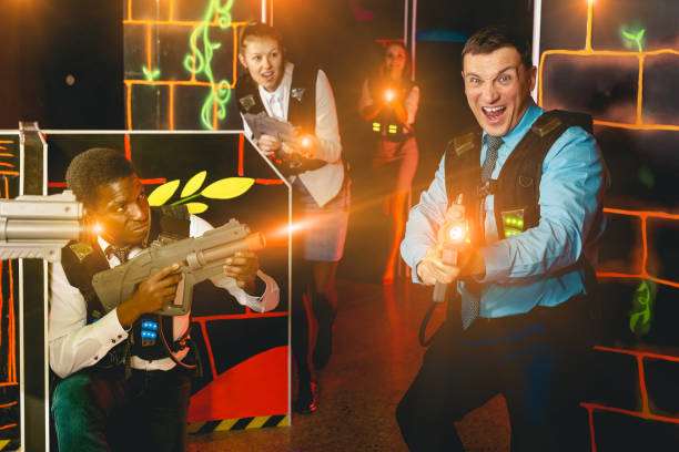 istock men and women co-workers having corporate entertainment 1350456408