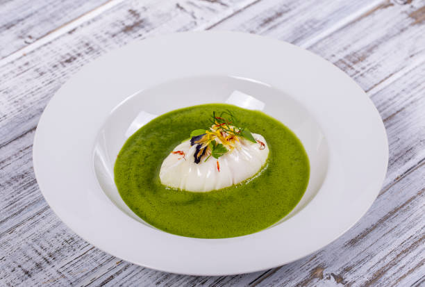 istock Green sauce with poached egg in white plate 1350461794