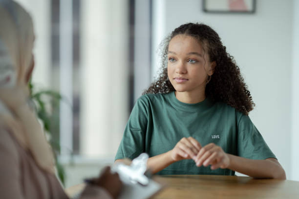 istock Teen in a Therapy session 1350464749