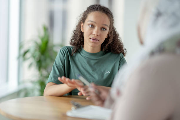 istock Teen in a Therapy session 1350464758