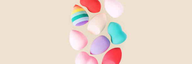 istock Colorful cosmetic beauty sponges different form Red, pink, rainbow colored makeup tools 1350464879