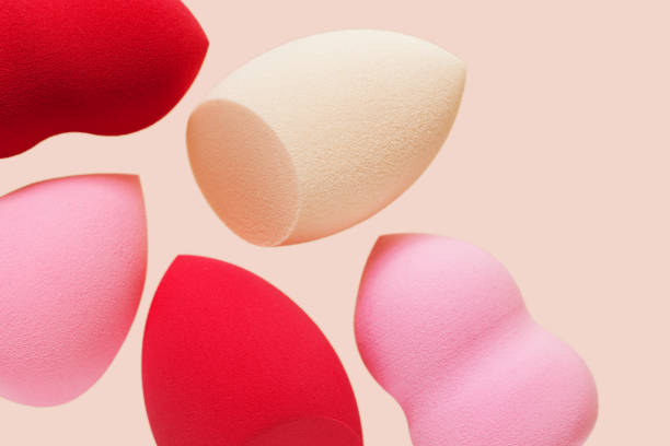 istock Bright cosmetic beauty sponges different form Red and pink colored makeup tools for tone cream, foundation, concealer. 1350464884