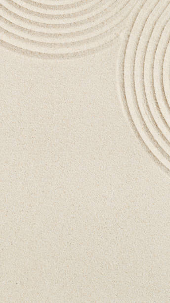 istock Lines drawing on sand, beautiful sandy texture. Spa background, minimal concept 1350464939