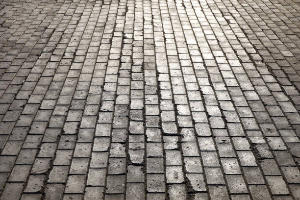 istock Stone pavement texture, cobbled street 1350465514