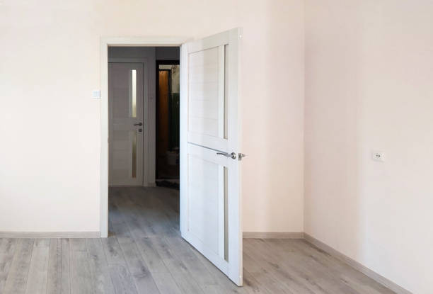 istock a wall with an open door in a new apartment 1350465555