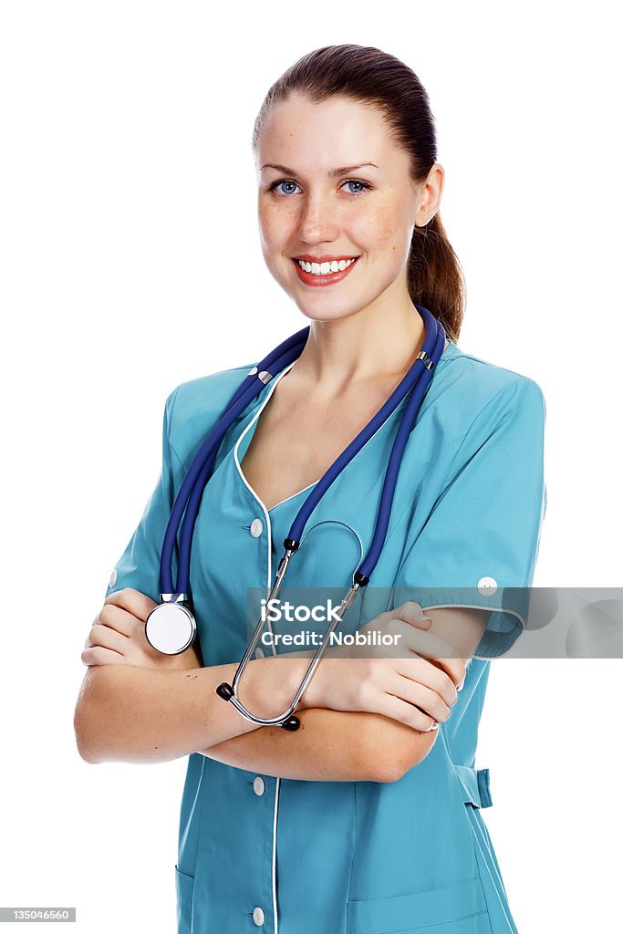 Ładny kobieta lekarz prowadzący badanie lub pielęgniarkę zaangażowaną w badanie - Zbiór zdjęć royalty-free (Badanie lekarskie)