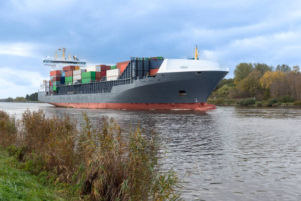 istock Container ship on the Kiel Canal near Kiel, Germany 1350468003