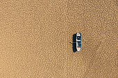istock Aerial view of a fishing boat on a drought dry lakebed. 1350469075