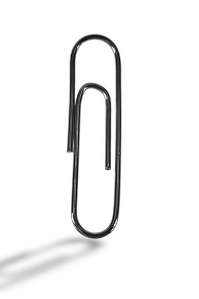 istock paper clip, metal chrome, on a white background, shadow in front. 1350470527