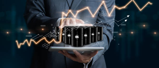 Businessman holding a group of barrels of oil with graphs of the stock market as a concept of raw material. 3D Render stock photo