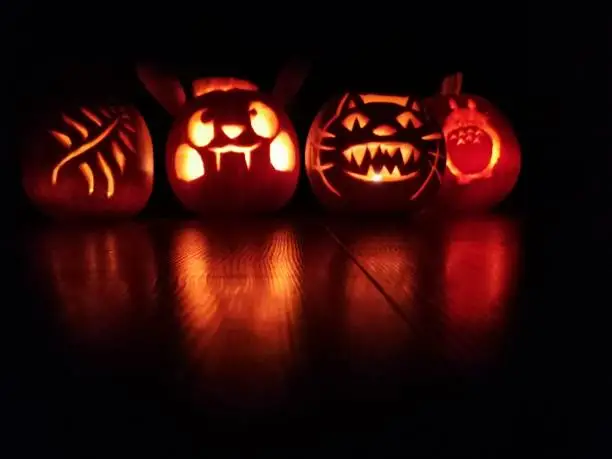 Cute pumpkin designs I did with my children for Halloween inspired by Pokemon and anime characters Toronto, the cat bus and pikachu. Candles light up the pumpkins to make it glow and spook y scary