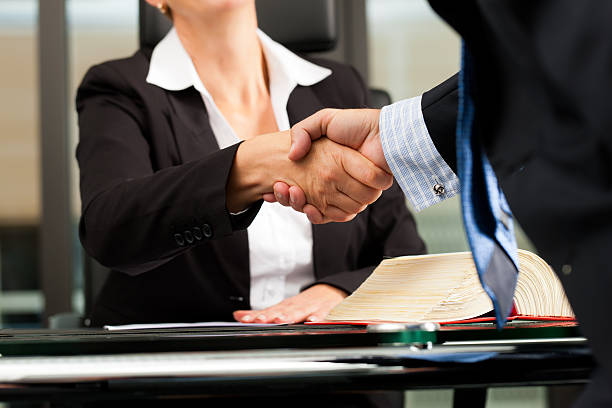 female lawyer or notary in her office - steno stok fotoğraflar ve resimler