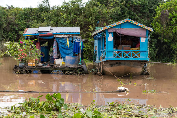 Floating Village, on Tonle Sap Lake, Cambodia - September 04: Appearances / Views from Floating Village, on Tonle Sap Lake, Cambodia. Floating House and Some Laundries. 04 2019 in Floating Village, Cambodia. (Footage by Sadi Ugur/Getty Images)