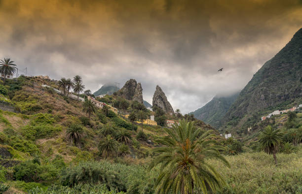 View on Mt. Garajonay against clear sky, back lit and lens flare. Village La Hermigua, plantations of bananas and other fruits.