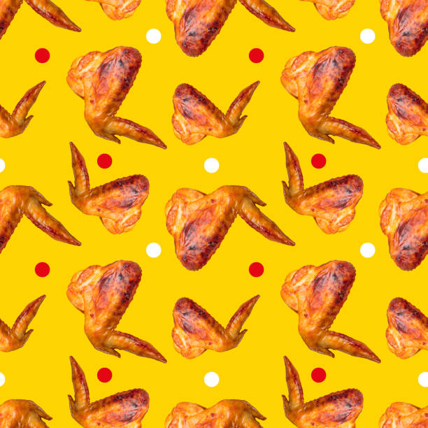 istock Barbecue chicken wings on a yellow background. Seamless pattern 1350480800