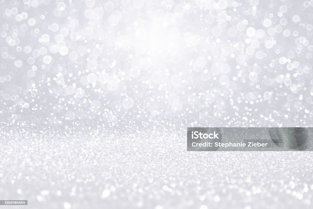 Silver white diamond jewelry background or Christmas snow glitter Fancy silver white light glitter sparkle confetti background for birthday party invite, winter Christmas ice snow fall, glam diamond jewelry shiny bling jewellery or celebrate 25th wedding anniversary Glittering Stock Photo