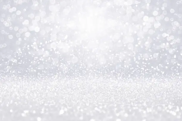 Photo of Silver white diamond jewelry background or Christmas snow glitter