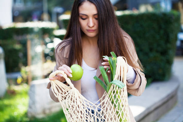 istock Young woman doing the groceries 1350488491