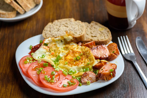 grilled sausage tasty fried egg and tomatoes - a nutritious breakfast for a hard day