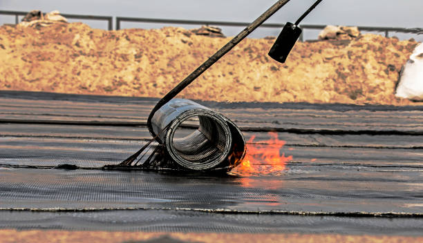 istock The process of installing roofing material using a blowtorch. The bituminous felt melts during the installation process. 1350490105