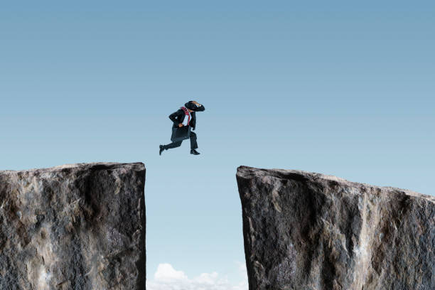 istock Man Taking A Leap Of Faith 1350490997