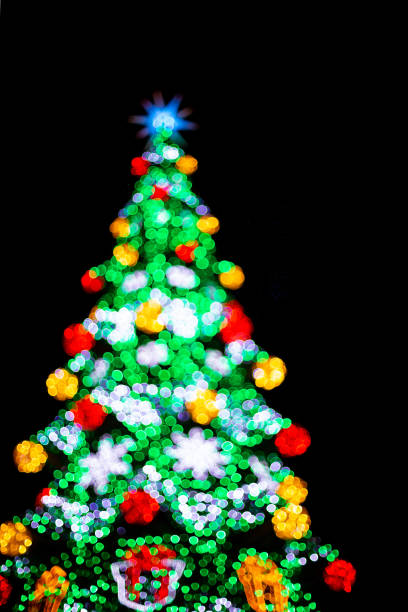 istock Festive blurred backdrop of Christmas tree decorated for Christmas 1350492901