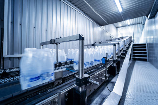 istock Modern strapping and transporting machine for packaging line at beverage plant. 1350493847