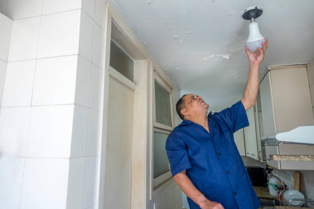 istock Electrician watches the nozzle of a kitchen light 1350493921