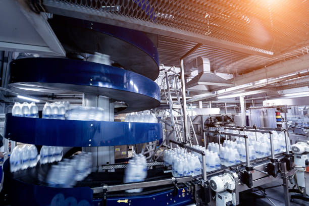 istock Modern strapping and transporting machine for packaging line at beverage plant. 1350496838