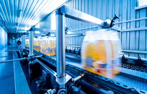 istock Modern strapping and transporting machine for packaging line at beverage plant. 1350496926