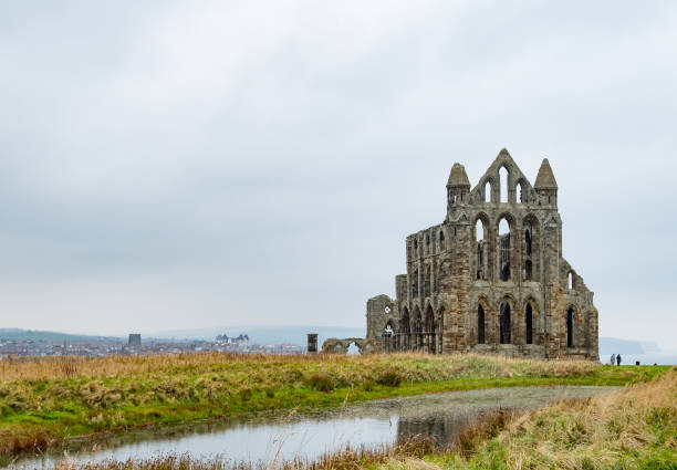 istock Historical Abbey on cliff top overlooking the North Sea 1350498487