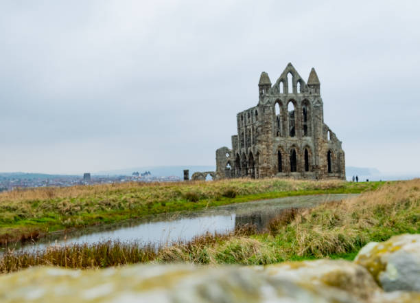 istock Historical Abbey on cliff top overlooking the North Sea 1350498617