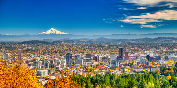 Panorama Portland Oregon skyline with Mt. Hood in Autumn Aerial view of Portland, Oregon take in Autumn mt hood stock pictures, royalty-free photos & images