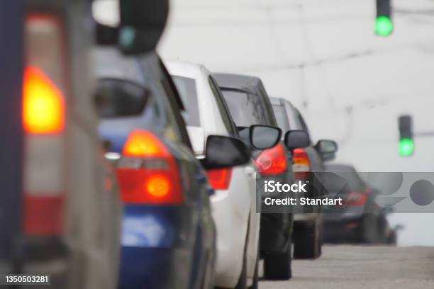 Blurred Road Car Congestion Traffic Background City Defocus Rush Hour Traffic Jam Blur Background Road City Congestion In Rush Hour Car Traffic Day Crowded Cars Moving Slowly On Road Busy City Blur Stock Photo - Download Image Now