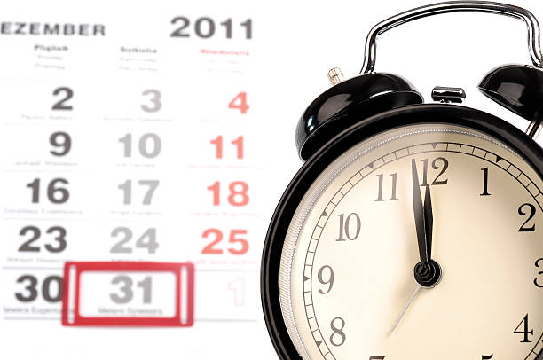 istock Old black alarm clock with calendar 135050685
