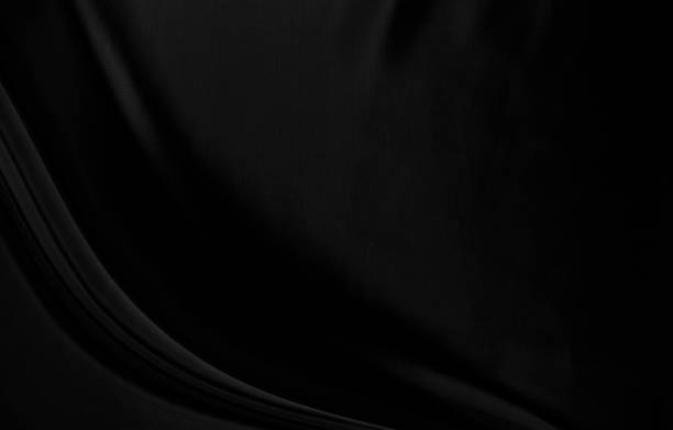 istock Black gray satin dark fabric texture luxurious shiny that is abstract silk cloth background with patterns soft waves blur beautiful. 1350507733