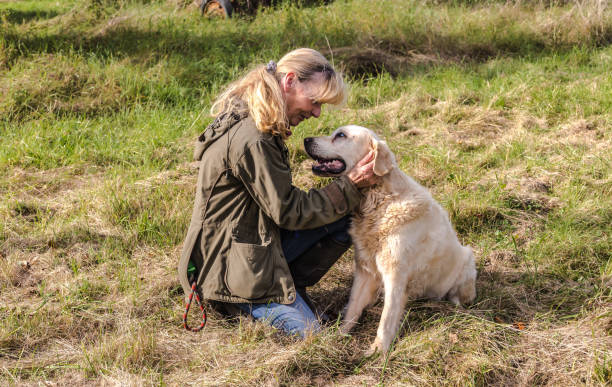 istock Dog owner feels happy with her Dog 1350509551