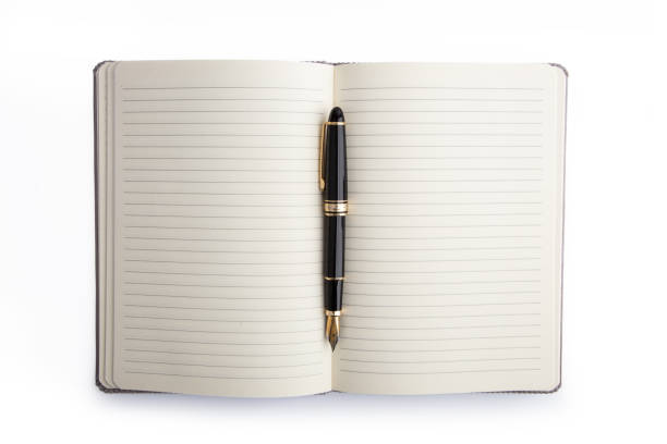 istock Blank book with lines and pen 1350509570