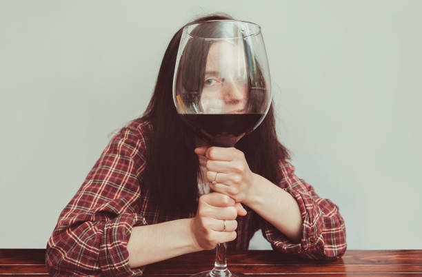 https://media.istockphoto.com/id/1350509675/photo/a-young-caucasian-girl-in-a-plaid-shirt-holds-a-large-glass-of-red-wine-and-looks-through-it.jpg?s=612x612&w=0&k=20&c=LorZ7Vl_EXoesI4nU0YHOsfkjqNDT-I7uaDwwsqfIJw=